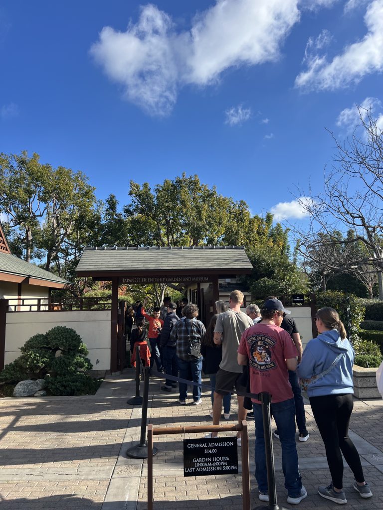 A line of people waiting to enter the Japanese Friendship Garden and Museum.