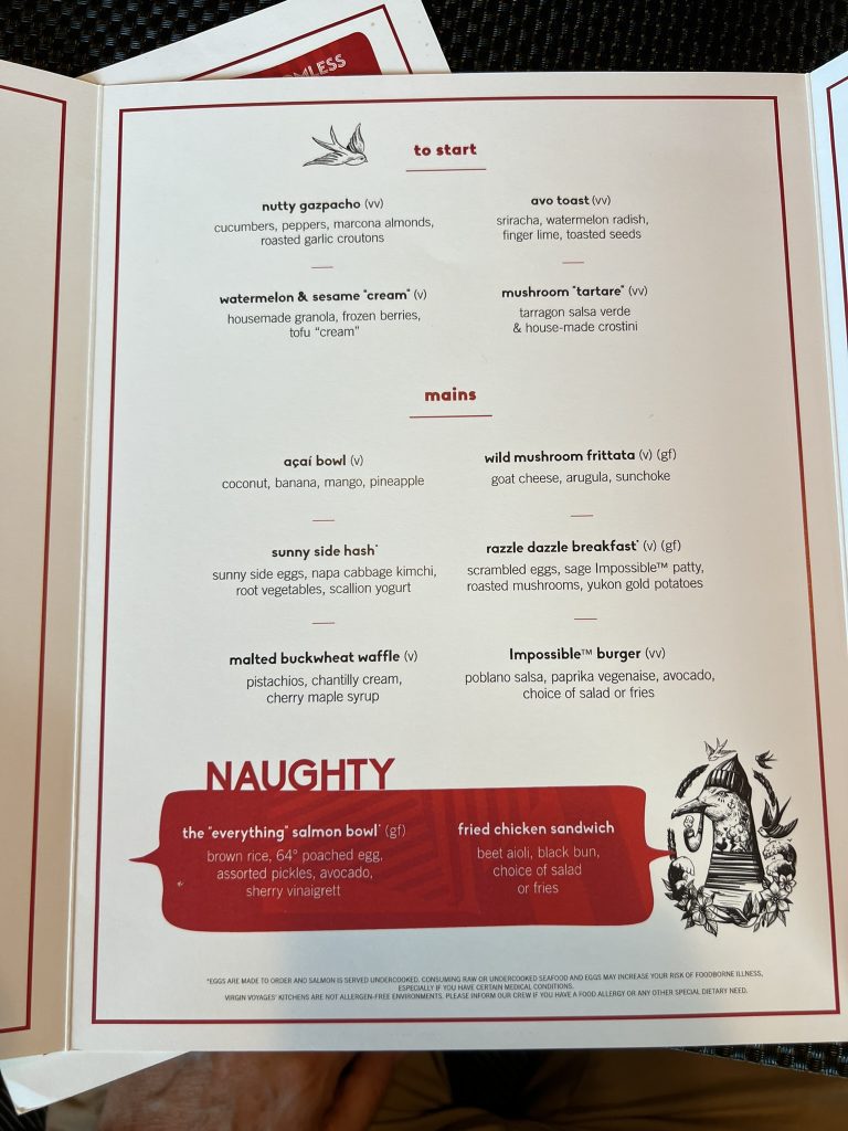Menu showing various dishes: Nutty Gazpacho, Avo Toast, Watermelon & Sesame "Cream," Mushroom "Tartare," Açaí Bowl, Wild Mushroom Frittata, Sunny Side Hash, Razzle Dazzle Breakfast, Malted Buckwheat Waffle, Impossible™ Burger. Naughty section: The "Everything" Salmon Bowl, Fried Chicken Sandwich.